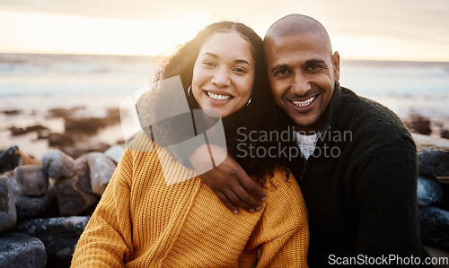 Image of Romantic, happy and portrait of a couple at the beach for a date, bonding or sunset in Bali. Love, hug and young man and woman smiling while relaxing at the ocean for vacation or an anniversary