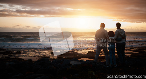 Image of Family, sunset and mockup with people on the beach looking at the view while bonding in nature. Rear view silhouette of a man, woman and child standing together enjoying the sunrise over the horizon