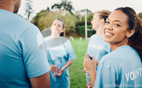 Image of Portrait, smile and volunteer woman with team outdoors for climate change, charity cleaning and recycling. Earth day, community service and happy female with group of environmental people at park.