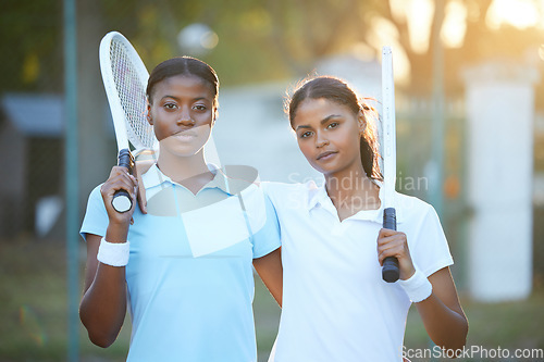 Image of Portrait, tennis and teamwork with sports women standing on a court outdoor together ready for a game. Fitness, collaboration or doubles partner with a serious female athlete and friend outside