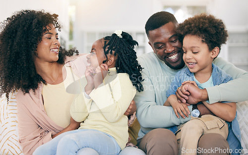 Image of Happy, love and black family bonding on the sofa together in the living room of their modern home. Happiness, smile and African children having fun with parents while sitting on the couch at house.