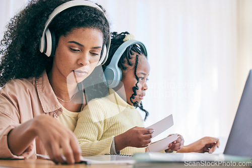 Image of Headphones, elearning and girl with mother and homework flash cards for study in a home. Online learning, digital kids app and computer of a child with a mom helping with school reading in a house