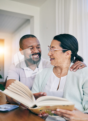 Image of Home reading, black couple and marriage with love, support and care in a house. Book, smile and happiness of a older woman and man together feeling happy in early retirement in the morning with books