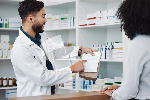 Image of Medication, prescription and explaining with a pharmacist man talking to a woman customer for healthcare. Medicine, consulting and insurance with a male health professional working in a pharmacy