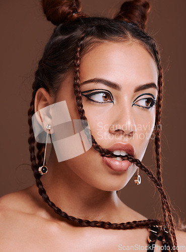 Image of Makeup, grunge and black woman in studio with gen z aesthetic, punk and rocker on brown background. Fashion, edgy and cool girl posing, creative and confident with contemporary, style and attitude