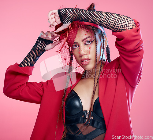 Image of Woman, studio portrait and leather fashion with punk, rock or heavy metal aesthetic by pink background. Gen z girl, fantasy and net clothes with beauty, makeup and cosmetics with trippy creativity
