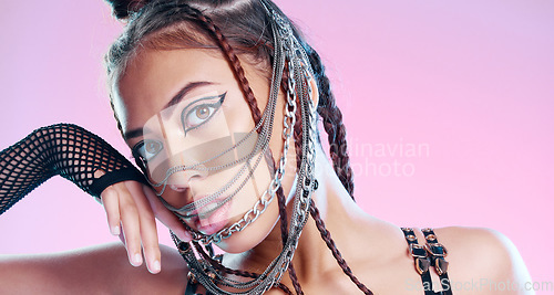 Image of Black woman, bdsm portrait and chain mask with metal, rock or punk aesthetic by pink background. Gen z model, sexy and grunge with trippy, psychedelic and creative with steel jewellery, face and mask