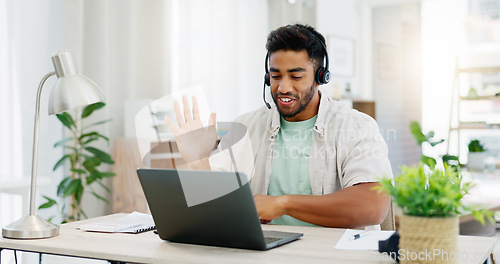 Image of Headphones, man and laptop for webinar, greeting and conversation in living room. Male, guy and person with device, headset and online conference for training, virtual chat and wave to start meeting