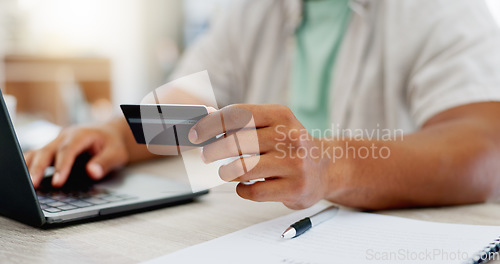 Image of Laptop, ecommerce or happy man online shopping with credit card for digital product with discount code. Smile, promo or customer with financial payment to buy on sale on fintech application at home