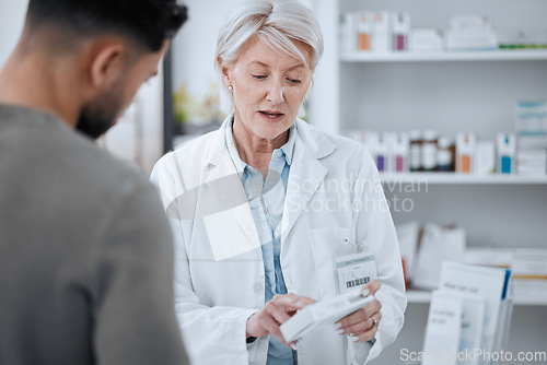 Image of Senior woman, pharmacist and customer in consultation for medication or prescription at drugstore. Mature female person, medical or healthcare employee with patient and pharmaceuticals at pharmacy