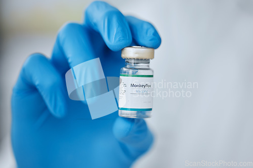 Image of Monkeypox, vaccine and glass bottle in hand, health and doctor person with safety from virus, closeup and medicine. Liquid medication, immune to disease and protection, healthcare and mockup space