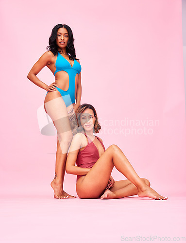 Image of Bikini portrait, friends and women in studio isolated on a pink background mockup space. Swimwear, together and girls with body positivity, inclusion and diversity in summer fashion at beach vacation
