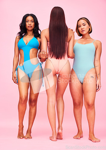 Image of Body positivity, bikini and group of women in studio, standing together in solidarity or diversity. Portrait of beauty, summer fashion and swimwear models with self love, equality and pink background