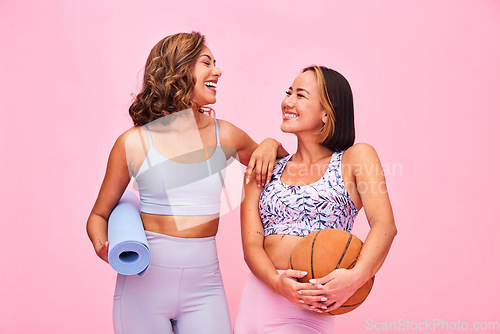 Image of Sports, fitness and women on pink background for yoga, training and exercise with ball and yogi mat. Friends, happy and people in studio with gym equipment for wellness, workout and healthy body