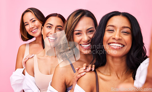 Image of Selfie, beauty and lingerie with model friends on a pink background in studio for natural skincare. Diversity, health and smile with the portrait of a group of women posing for wellness or inclusion