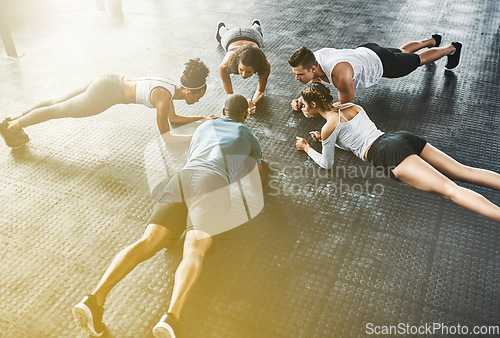 Image of People, fitness and push up in class, group or circle for workout, training and community support. Exercise team, friends and athlete in gym for lose weight, sports and health or accountability above