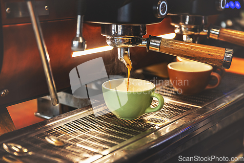 Image of Espresso pouring from coffee machine