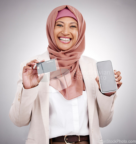 Image of Business woman, credit card and phone screen for islamic fashion, online shopping and e commerce mockup in studio. Muslim person in hijab portrait, mobile fintech and bank payment on white background