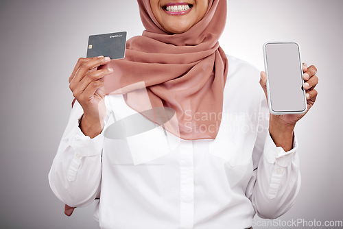 Image of Woman, hands and credit card with phone screen, fashion e commerce and online shopping mockup in studio. Happy muslim or islamic person with mobile fintech, banking and payment on a white background