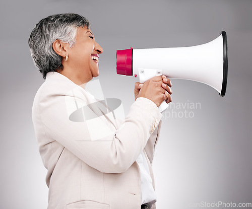 Image of Business woman, megaphone and voice of news, broadcast or sale and announcement on a white background. Mature person, leader or happy speaker in noise, call to action and attention or deal in studio