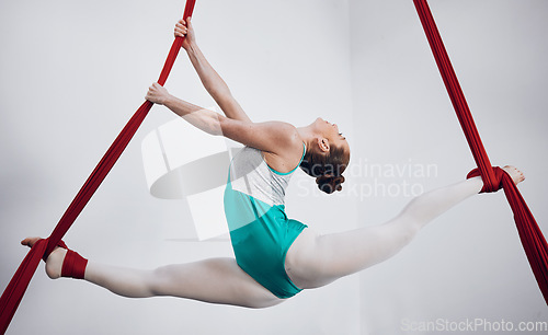 Image of Gymnastics, woman acrobat with performance and fitness, sports and art with athlete on white background. Gymnast, training and exercise with creativity, talent with fabric and competition in studio