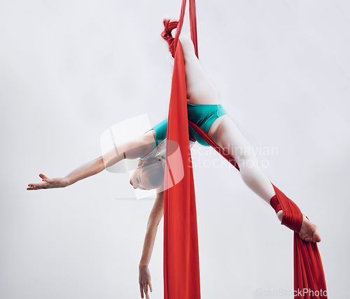 Image of Aerial, woman gymnast and training performance with stretching, flexibility split and athlete with white background. Workout, exercise and gymnastics with balance art and dance acrobat competition