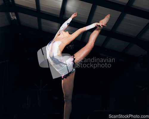 Image of Fitness, stretching and performance with a dance woman in a gym for training or practice for a competition. Exercise, event and form with a female gymnastic or rhythmic dancer in a workout studio