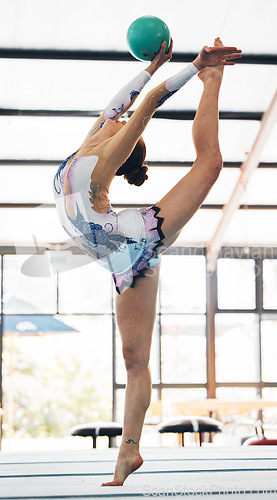 Image of Woman, ball and stretching for gymnastics competition, performance and balance for solo concert in arena. Flexible dancer, rhythm and athlete training with talent, showcase or split for agile contest