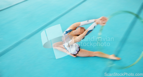 Image of Fitness, training with a gymnastics hoop and a woman in the gym for a performance showcase or practice. Dance, energy and concert with a female athlete on a studio floor for routine or recital