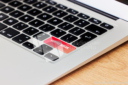 Image of Laptop, keyboard and coffee break key on table in business office for rest period, relax and pause. Computer, closeup of function and recharge from pc technology, internet and email in corporate job