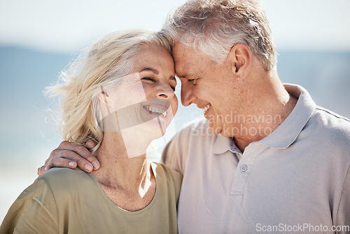 Image of Senior couple, happy and outdoor at the beach with love, freedom and care on vacation. Face of a man and woman on retirement holiday, adventure and romantic trip in nature to relax and travel