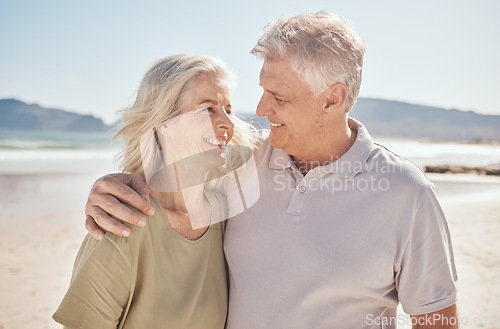 Image of Senior couple, smile and outdoor at the beach with happiness, freedom and care on vacation. Man and woman on retirement holiday, adventure and romantic trip in nature to relax and travel with love