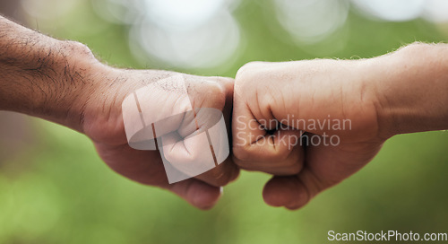 Image of Support, welcome and fist bump with hands of people in nature for motivation, thank you and meeting. Teamwork, trust and collaboration with closeup of friends in park for partnership and solidarity