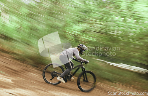 Image of Bicycle, woods and man travel, blur and workout outdoor in forest for healthy body. Mountain bike, nature and athlete training, cycling fast and off road adventure on journey, freedom or sport race