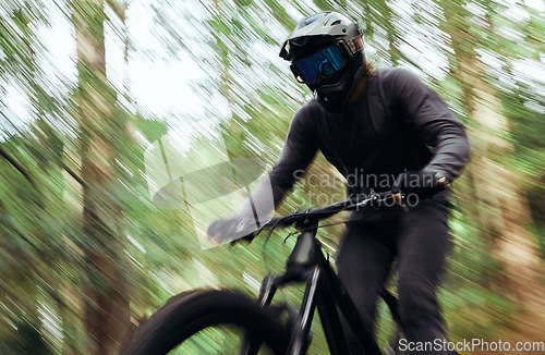 Image of Bicycle, forest and man travel, speed and workout outdoor in woods for healthy body. Mountain bike, nature and athlete training, cycling blur and off road adventure on journey, freedom and fast sport