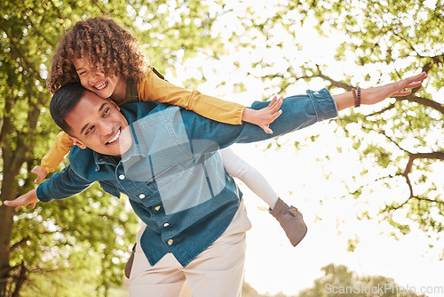 Image of Nature, fly and happy child, father and piggyback ride for fun outdoor games, Fathers Day bonding and quality time together. Woods, park and family dad, kid and playing with love, support and care