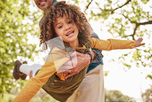 Image of Dad, child and plan game in park, outdoor and nature on holiday, freedom or care with bonding. Excited young kid, father and swing for airplane, fast and free with play on vacation in summer sunshine