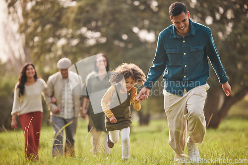 Image of Family, park and parents with children in nature for playing, bonding and running together in field. Happy grandparents, mother and father with girl relax outdoors on holiday, adventure and vacation