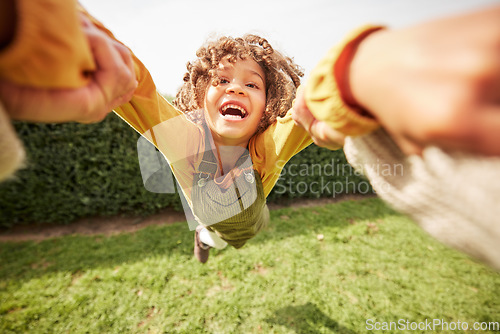 Image of Child, spin and outdoor in pov, holding hands and happy for game with parent, holiday and backyard. Excited young kid, smile and swing in air, fast and lawn for play on vacation in summer sunshine
