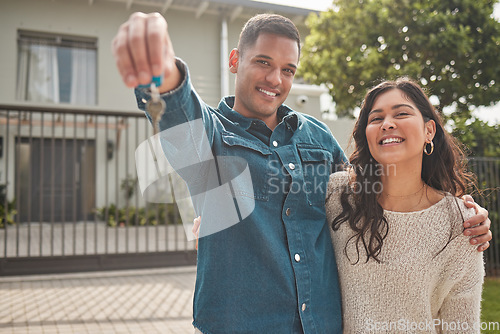 Image of Happy couple, portrait and real estate with keys to new home in property investment together. Man and woman or homeowners smile for moving in, buying or building loan in asset, finance or investing