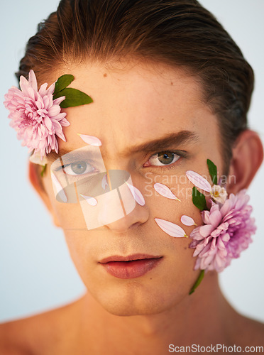 Image of Beauty, aesthetic and flowers with portrait of man in studio for petals, natural and creative. Glow, cosmetics and spring with face of model on white background for makeup, spa and floral wellness