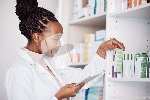 Image of Pharmacy, woman and digital tablet on medicine shelf, healthcare inventory and boxes or stock management. Medical pharmacist or african doctor for pills search, drugs package or e commerce technology