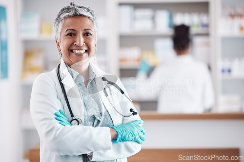 Image of Senior, woman and doctor, portrait with arms crossed and healthcare, medical professional and hospital dispensary. Pharmacy, health and confidence, smile with wellness and drugs, medicine and service