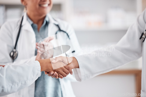 Image of Clapping, teamwork or doctors shaking hands for success, good job or promotion goal in a hospital meeting. Closeup, congratulations or proud healthcare worker with handshake for medical collaboration