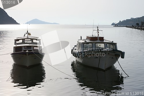 Image of two dark boats