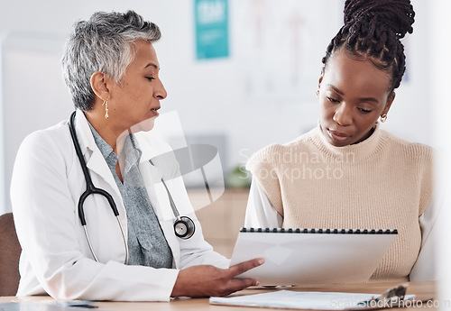 Image of Documents, meeting or doctor consulting a patient in hospital for healthcare history or record. People, medical or nurse with black woman talking or speaking of test results, insurance or advice