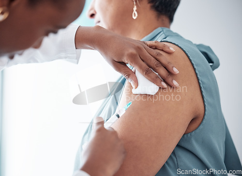 Image of Medicine, healthcare and doctor with woman for vaccination in a clinic for medical treatment for prevention. Closeup of a nurse doing a vaccine injection with a needle syringe in a medicare hospital.