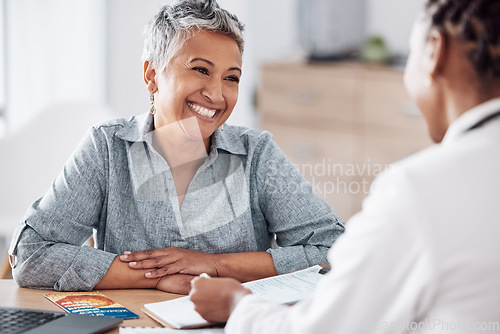 Image of Paperwork, doctor or consulting a happy patient in meeting talking in hospital for history or healthcare record. Smile, medical or nurse with mature woman speaking of test results, update or document