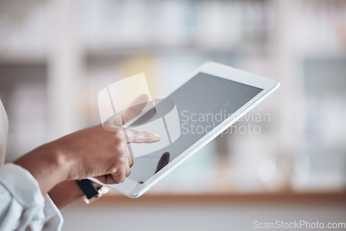 Image of Woman pharmacist with tablet, typing in clinic and research for medical information, email or online chat. Digital app scroll, networking and doctor in pharmacy checking social media or internet news