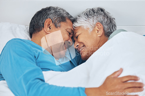 Image of Bed, care and old couple with love, relax and marriage with retirement, relationship and romance. Morning, happy elderly man or senior woman with trust, bedroom and bonding with peace, home and smile